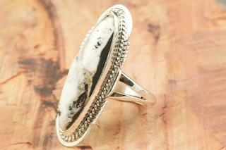 White Buffalo Turquoise set in Sterling Silver Ring. This Beautiful Stone is formed from the minerals Calcite and Iron. It is mined near Tonopah Nevada. Created by Navajo Artist Margaret Platero. Signed by the Artist.